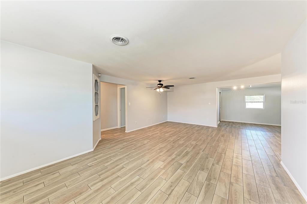 4010 South Lockwood Ridge Road Sarasota, FL 34231 - Photo 7 of 48 a view of an empty room and a window