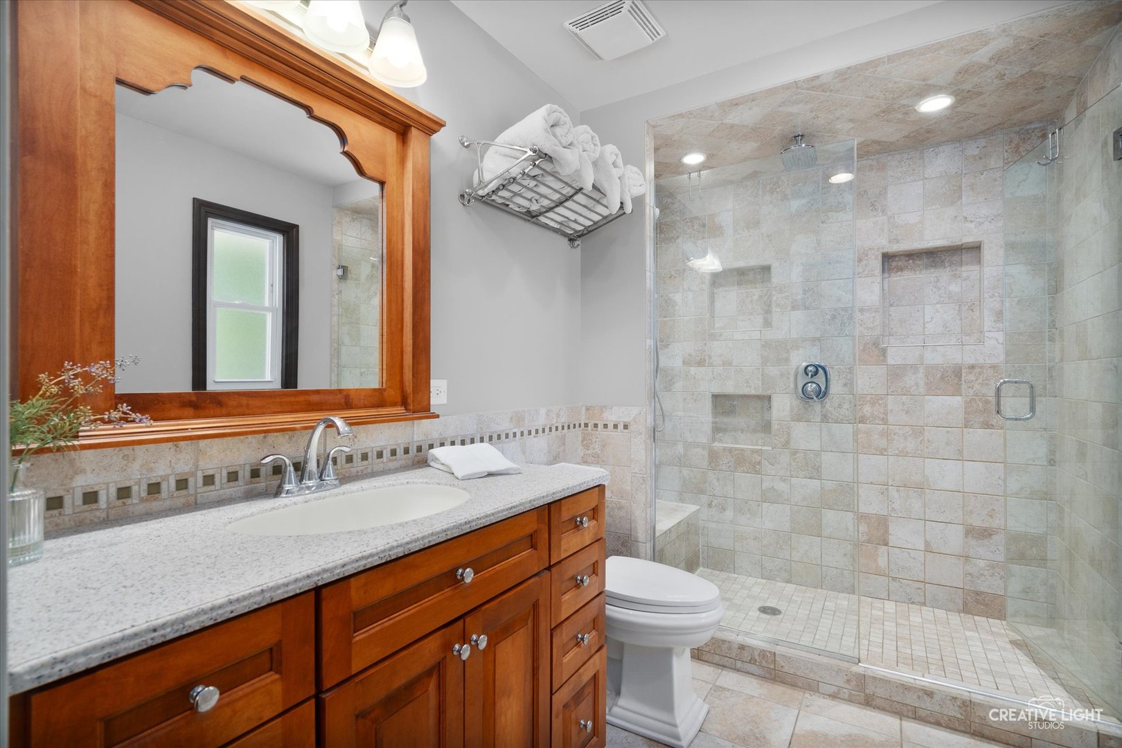 201 Pepperidge Road Naperville, IL 60540 - Photo 13 of 31 a bathroom with a sink a toilet and shower