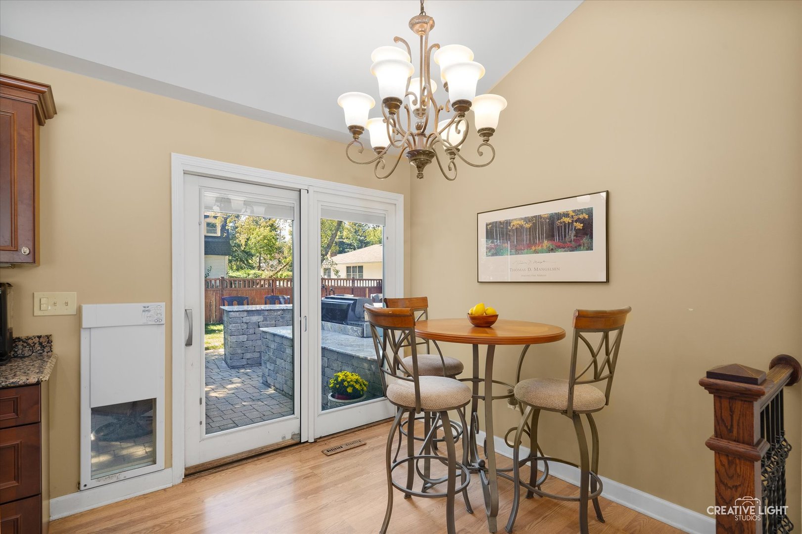 201 Pepperidge Road Naperville, IL 60540 - Photo 16 of 31 a dining room filled chandelier and wooden floor