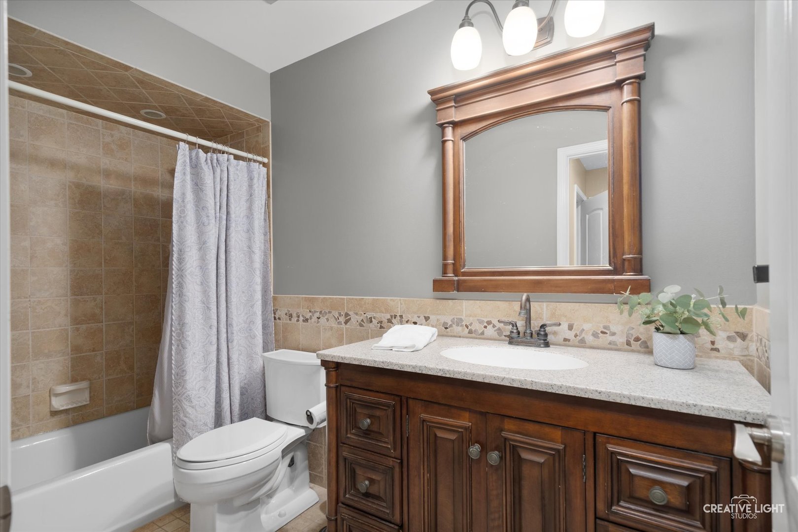 201 Pepperidge Road Naperville, IL 60540 - Photo 17 of 31 a bathroom with a granite countertop sink a toilet and a mirror