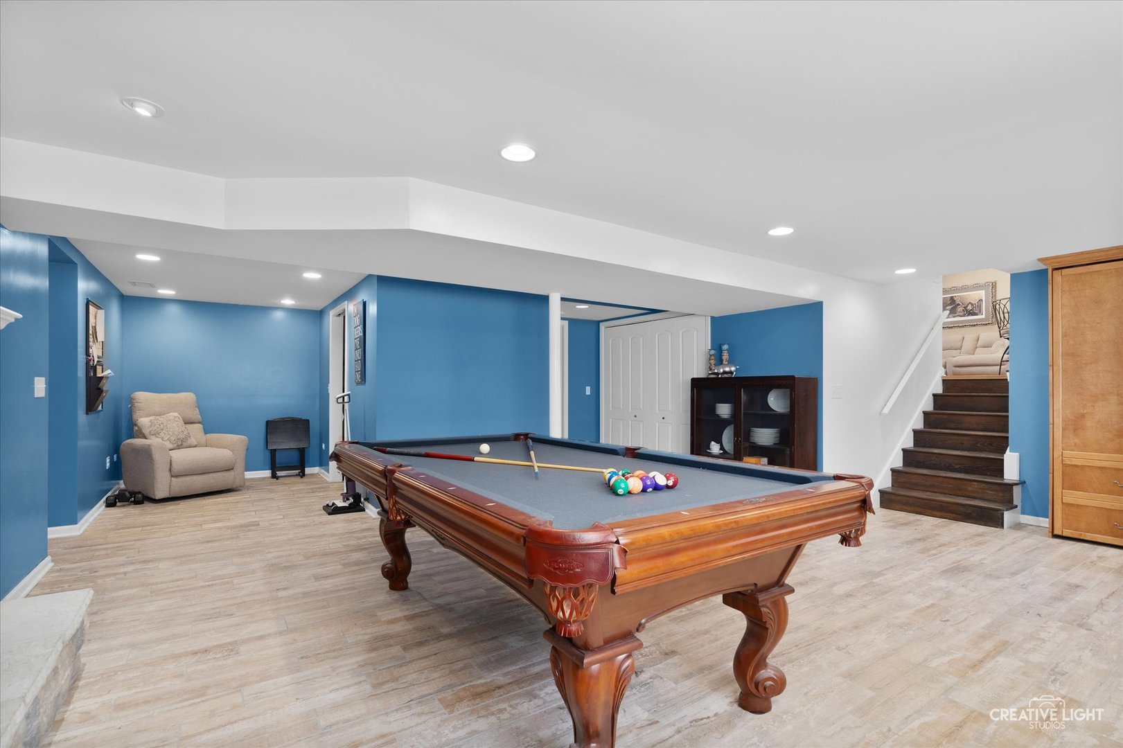 201 Pepperidge Road Naperville, IL 60540 - Photo 19 of 31 a room with pool table and stairs