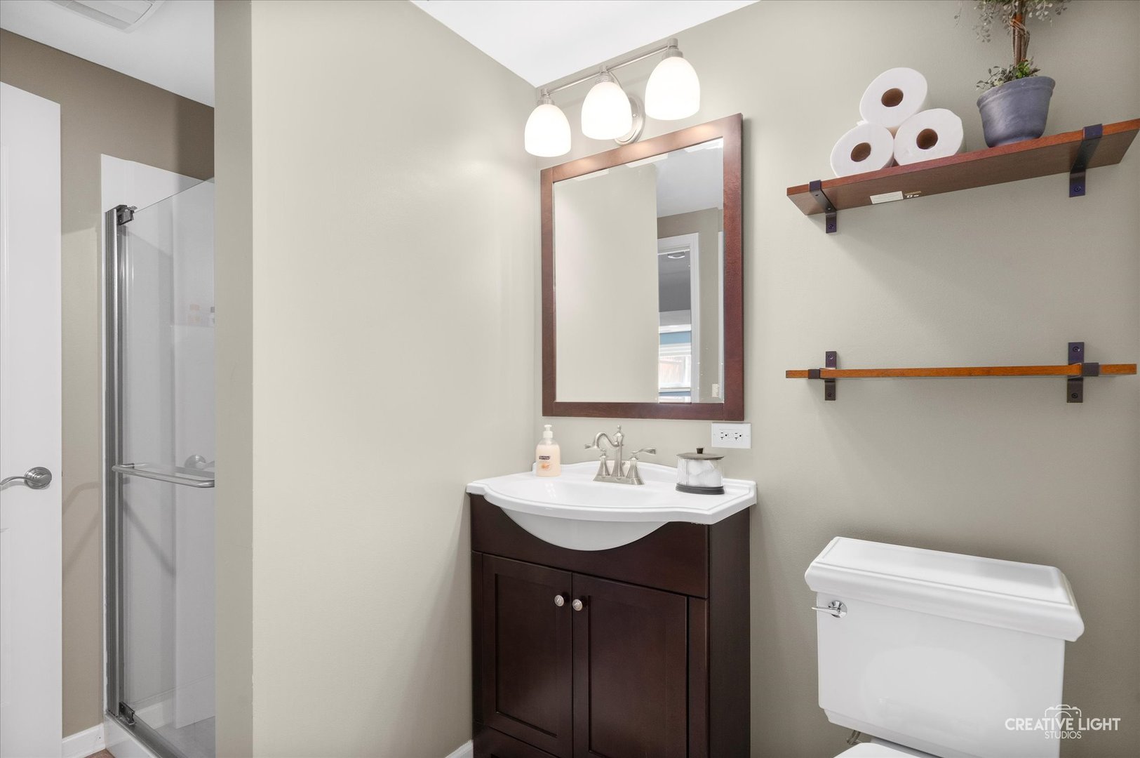 201 Pepperidge Road Naperville, IL 60540 - Photo 21 of 31 a bathroom with a sink a toilet and mirror