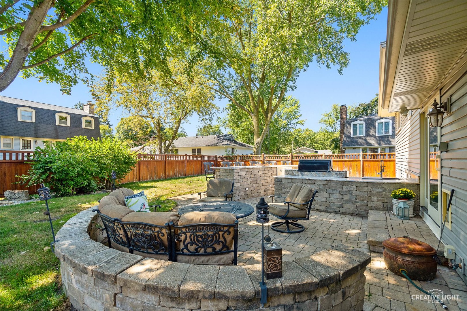 201 Pepperidge Road Naperville, IL 60540 - Photo 24 of 31 a view of a patio with couches table and chairs and potted plants