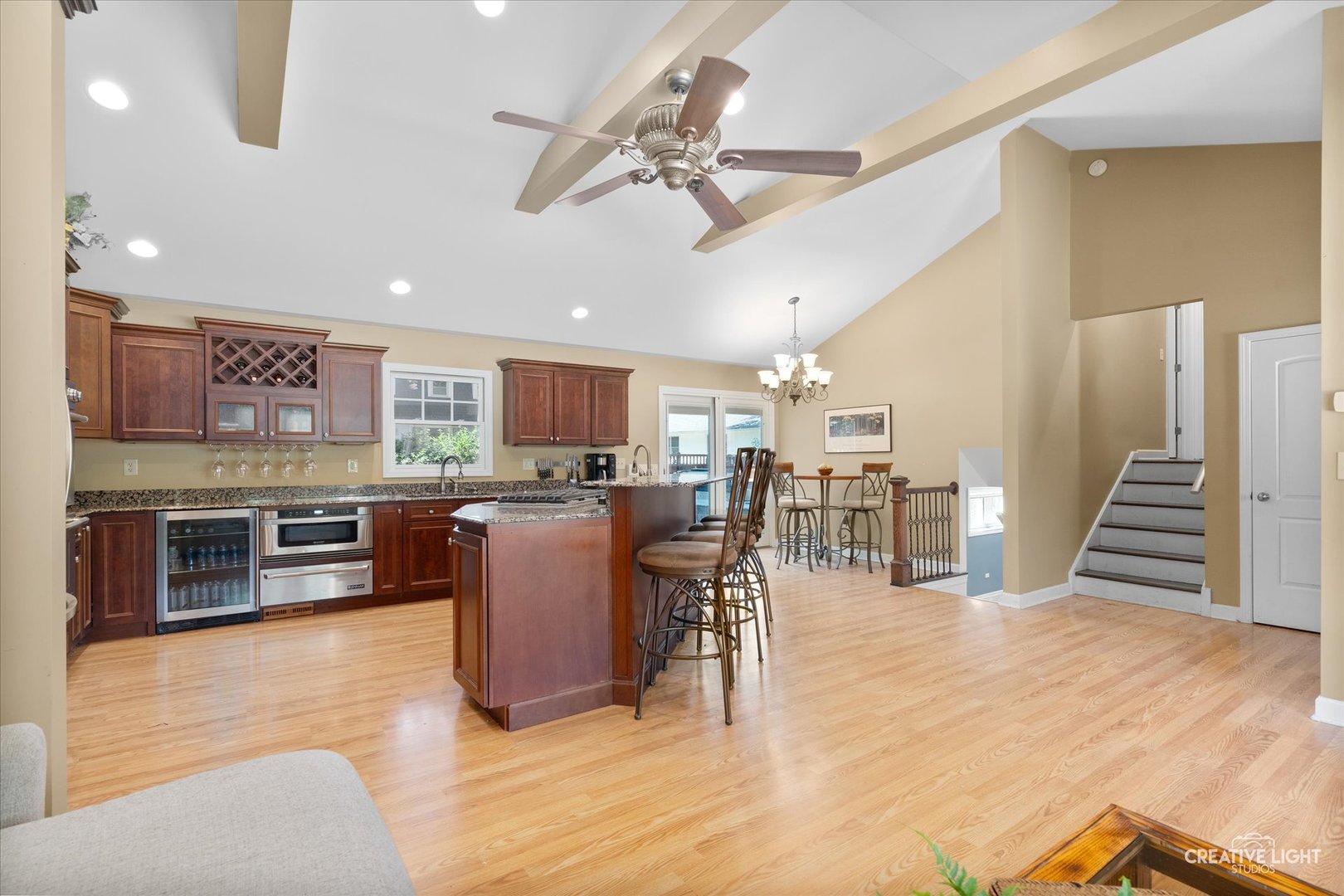 201 Pepperidge Road Naperville, IL 60540 - Photo 7 of 31 a large kitchen with stainless steel appliances kitchen island granite countertop a large center island and a sink