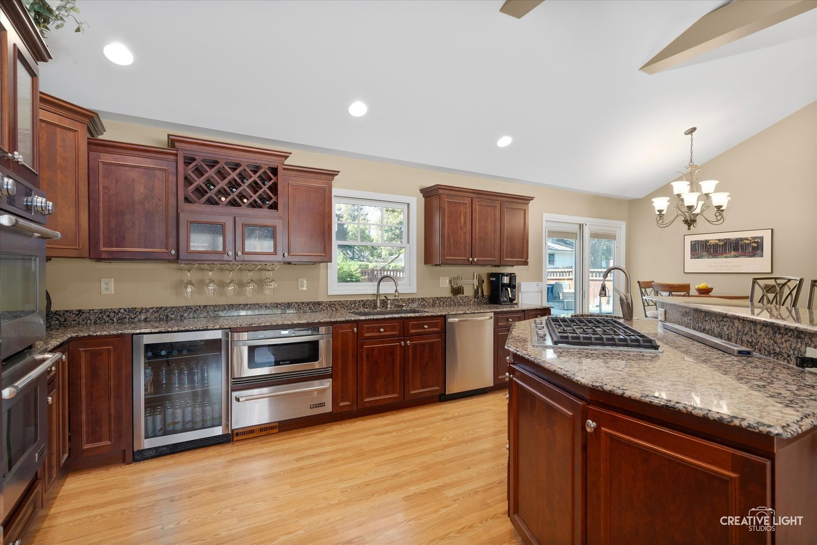201 Pepperidge Road Naperville, IL 60540 - Photo 9 of 31 a kitchen with stainless steel appliances granite countertop a stove sink and cabinets