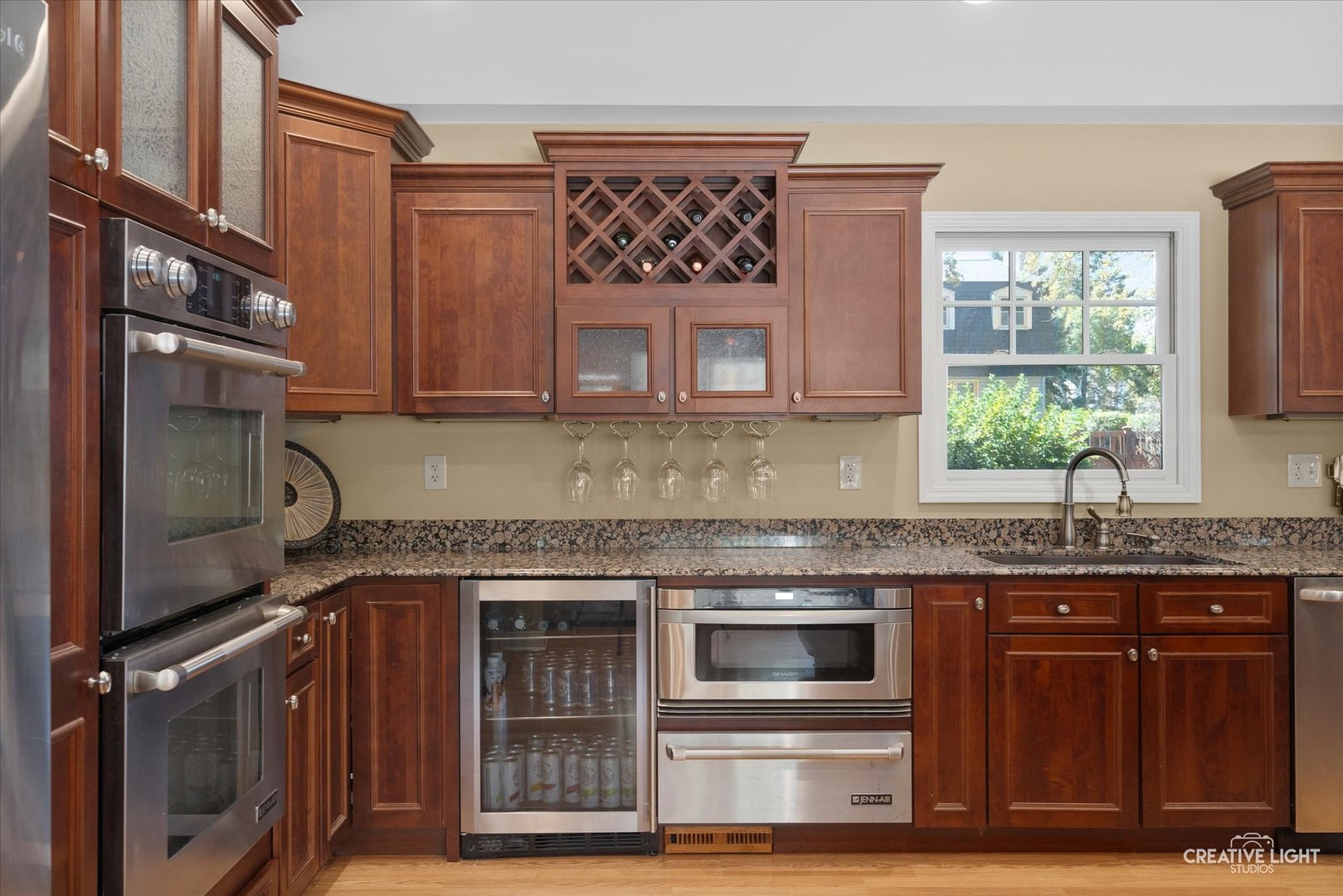 201 Pepperidge Road Naperville, IL 60540 - Photo 10 of 31 a kitchen with granite countertop a stove and a sink