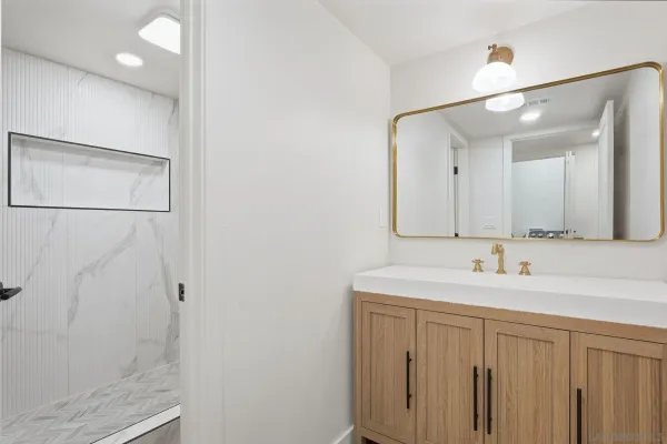 a kitchen with stainless steel appliances granite countertop a sink a stove a refrigerator and cabinets