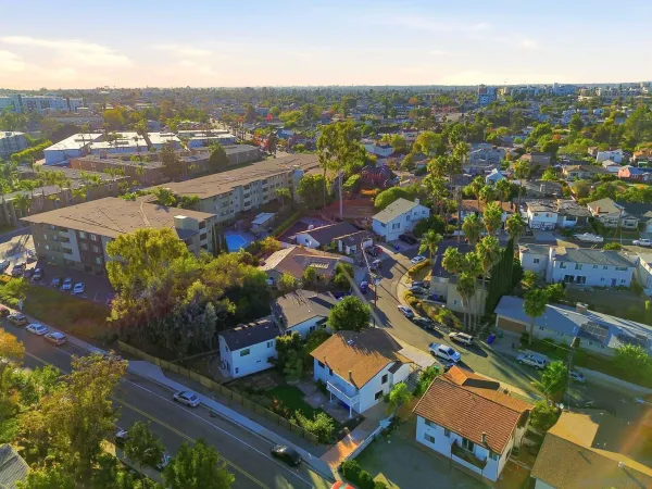an aerial view of residential houses with outdoor space