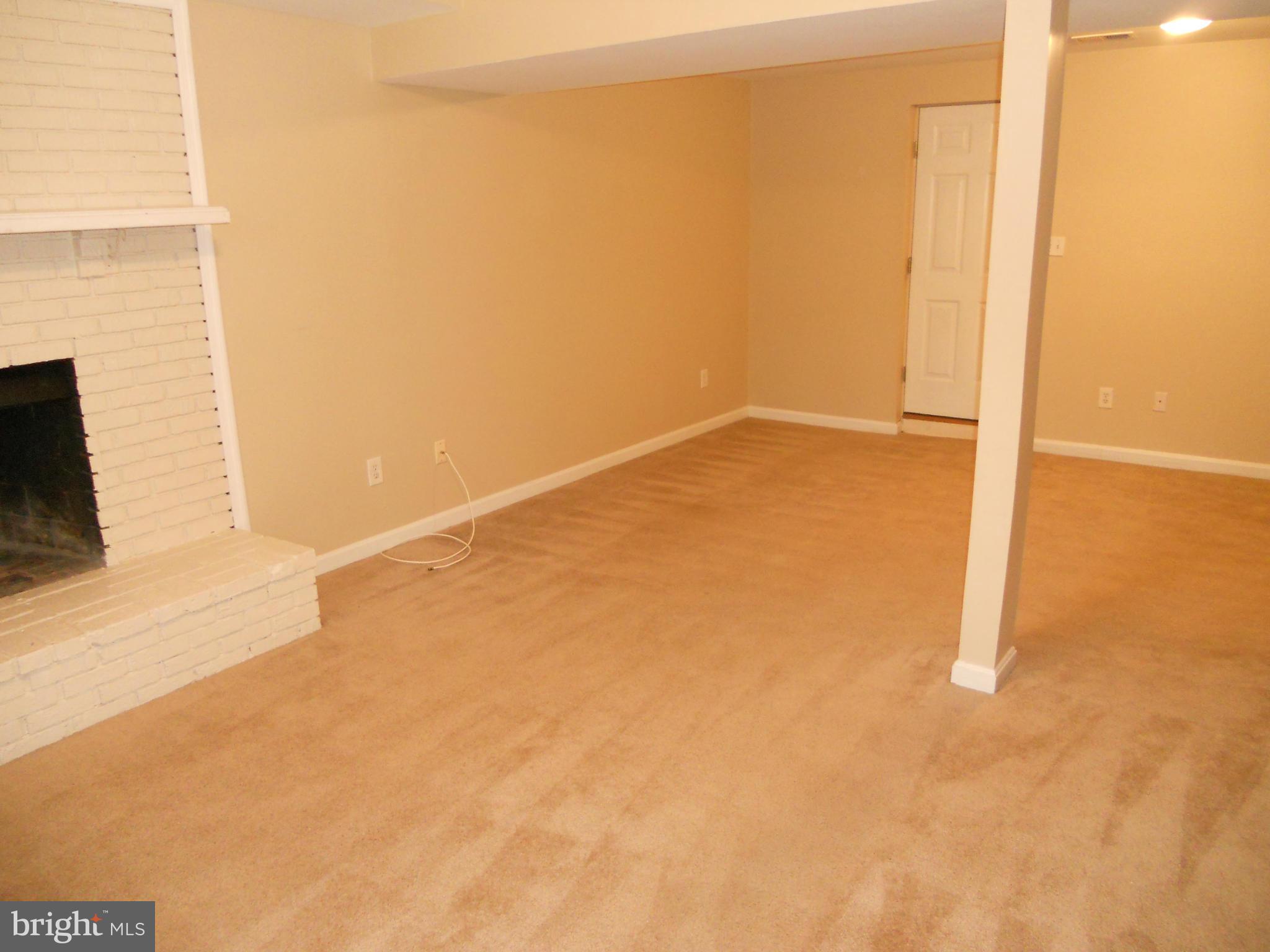 9151 Fort Smallwood Road Pasadena, MD 21122 - Photo 14 of 17 Large finished Basement Rec Rm with FP