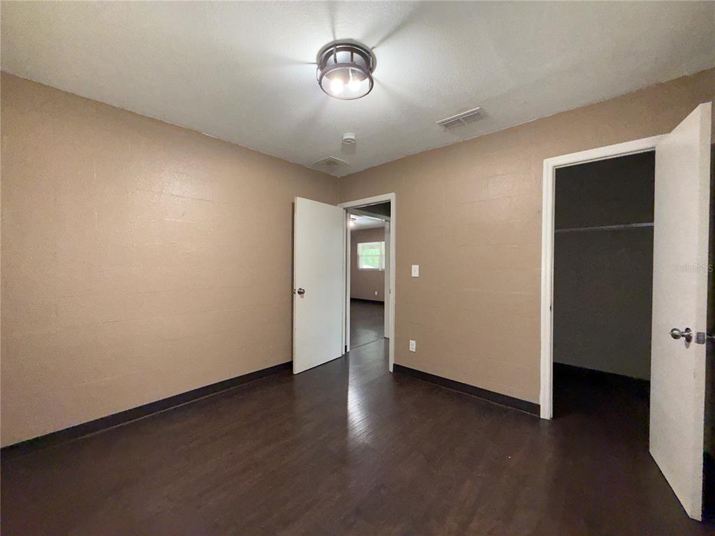 305 Marker Street Altamonte Springs, FL 32701 - Photo 11 of 15 a view of an empty room with wooden floor