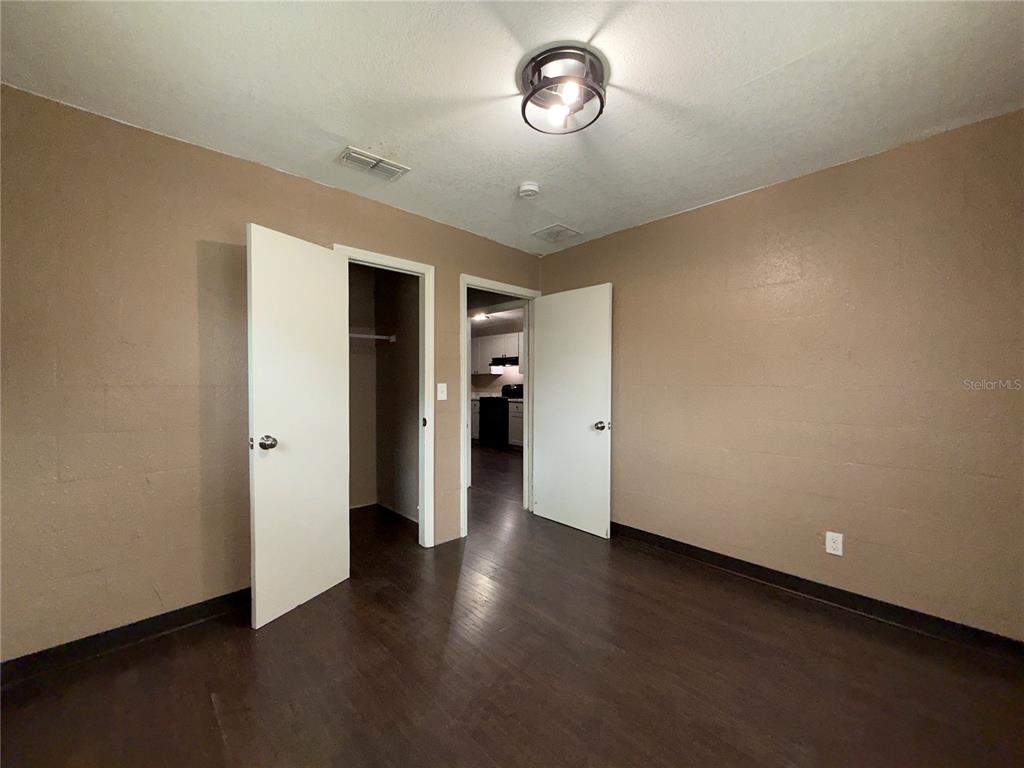 305 Marker Street Altamonte Springs, FL 32701 - Photo 9 of 15 an empty room with wooden floor and closet
