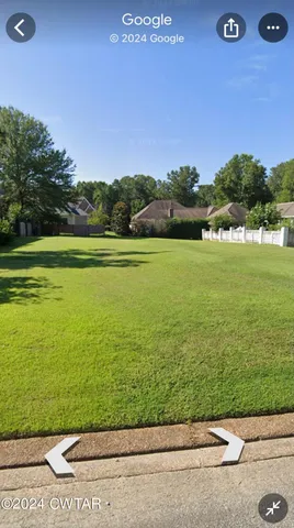 a view of pool with trees