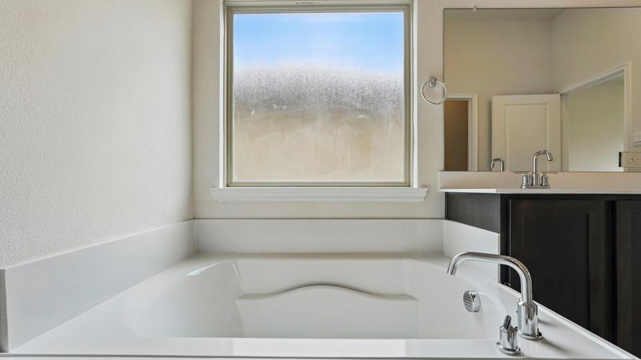 4187 Plateau Drive Forney, TX 75126 - Photo 23 of 36 a bathroom with a bathtub