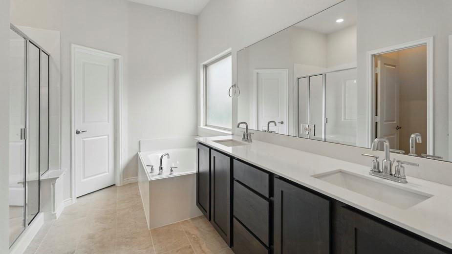 4187 Plateau Drive Forney, TX 75126 - Photo 25 of 36 a bathroom with a double vanity sink and a mirror