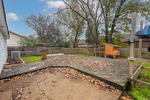 a view of a backyard with a trampoline