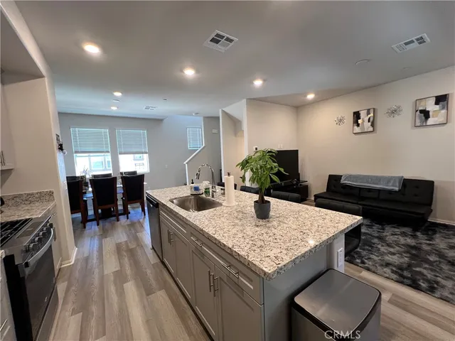 a kitchen with a stove and a refrigerator