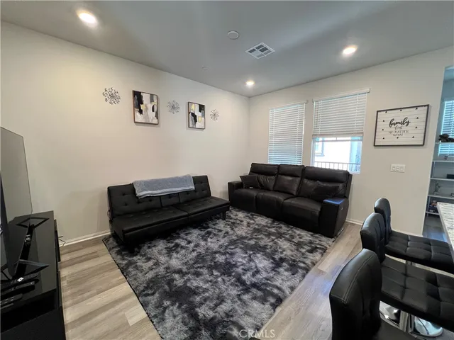 a living room with furniture or couch and a flat screen tv