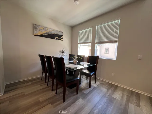 a view of a dining room with furniture and window