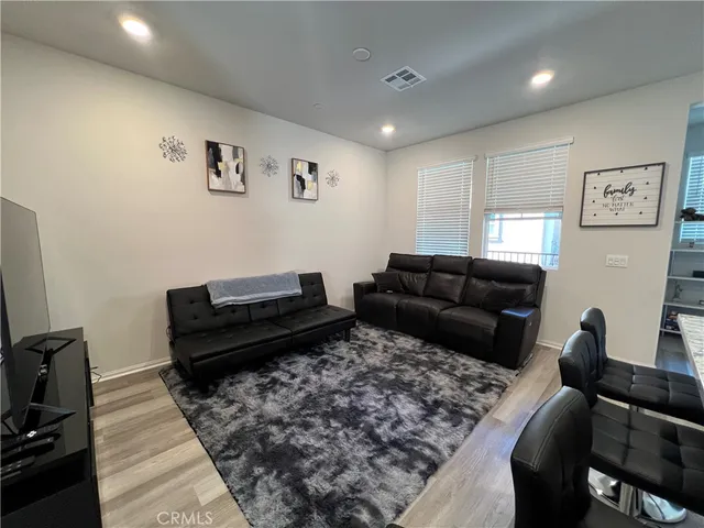 a living room with furniture or couch and a flat screen tv
