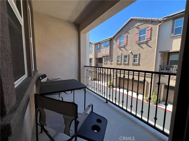 a view of a balcony with a potted plant