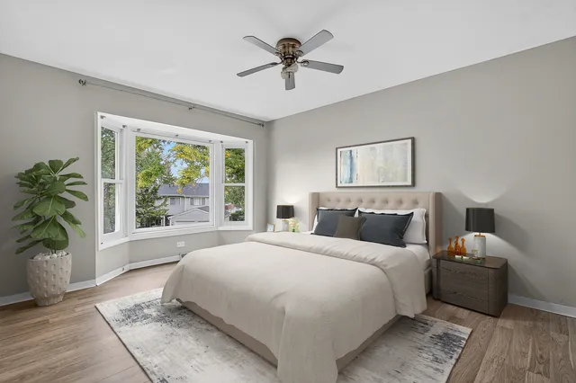 a bedroom with bed and a window