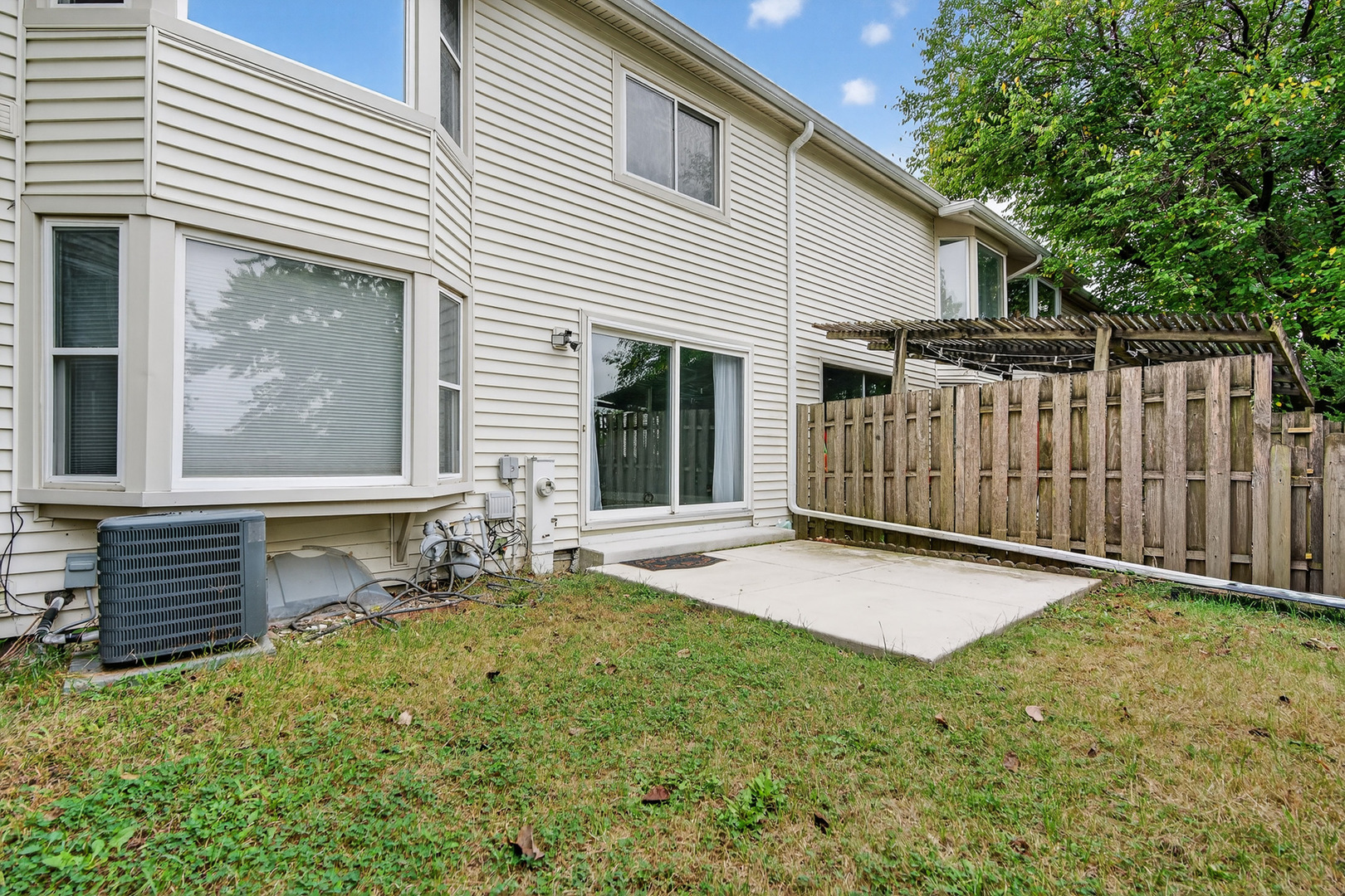 535 Jordan Way Bolingbrook, IL 60440 - Photo 32 of 35 a view of backyard with wooden fence and a large tree