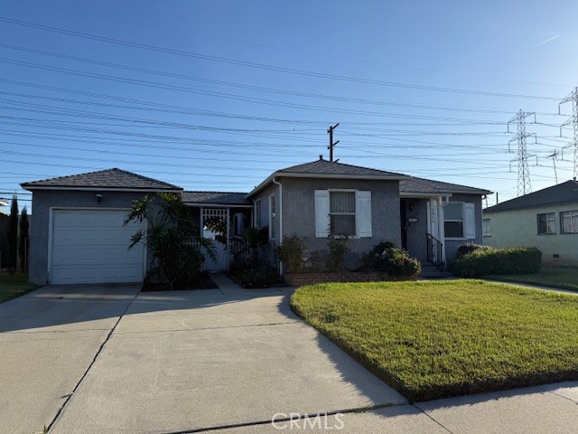 1310 West Bennett Street Compton, CA 90220 - Photo 2 of 2 a front view of a house with a yard