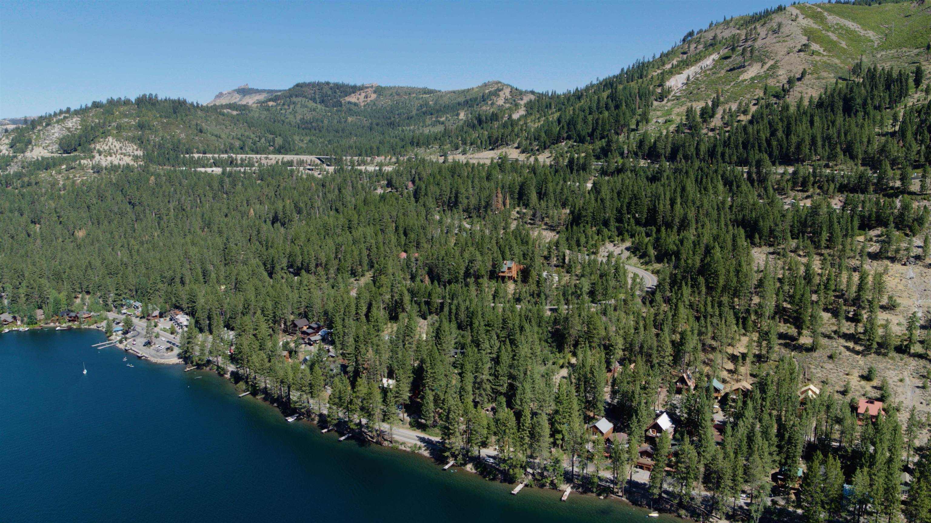 10575 Donner Lake Road Truckee, CA 96161 - Photo 3 of 6 a view of a lake with a mountain in the background