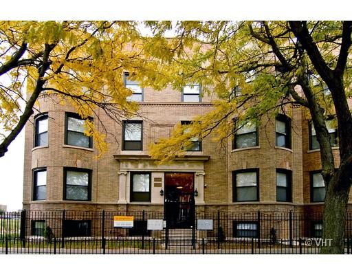 5201 South Indiana Avenue, Unit G Chicago, IL 60615 - Photo 1 of 5 a front view of a residential apartment building with a yard