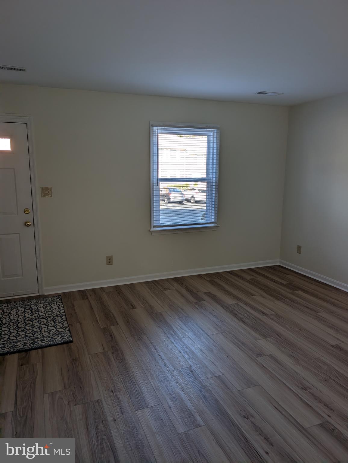 131 Farrell Lane Fredericksburg, VA 22401 - Photo 3 of 22 an empty room with wooden floor and windows