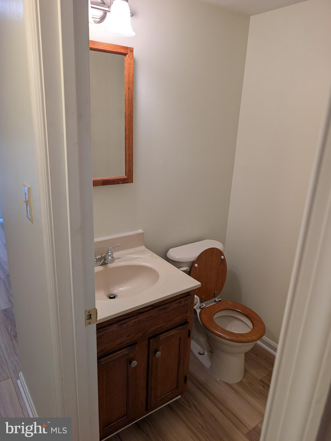131 Farrell Lane Fredericksburg, VA 22401 - Photo 6 of 22 a bathroom with a granite countertop toilet sink and mirror