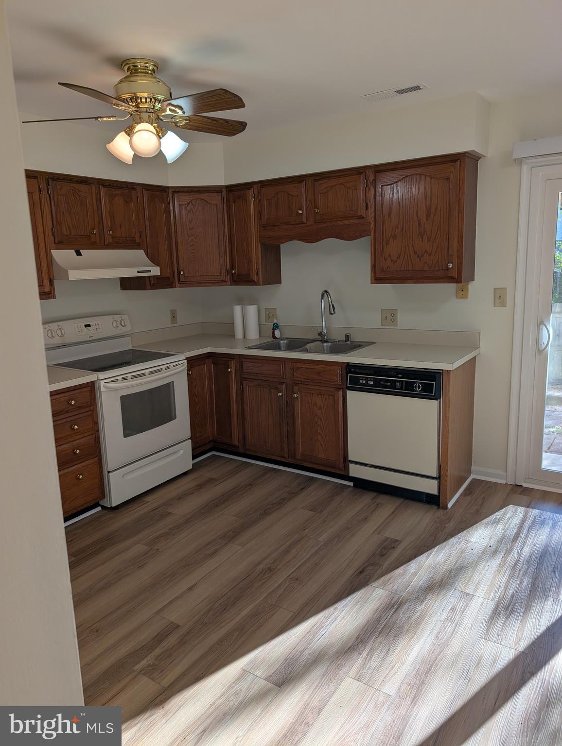 131 Farrell Lane Fredericksburg, VA 22401 - Photo 8 of 22 a kitchen with stainless steel appliances granite countertop a stove a sink and a microwave