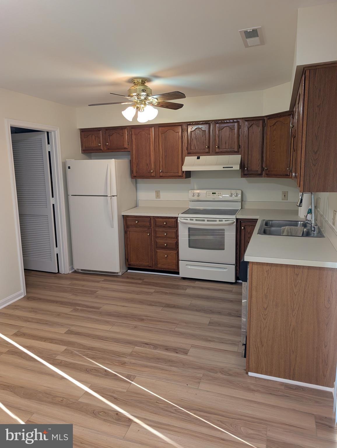 131 Farrell Lane Fredericksburg, VA 22401 - Photo 9 of 22 a kitchen with a stove cabinets and wooden floor