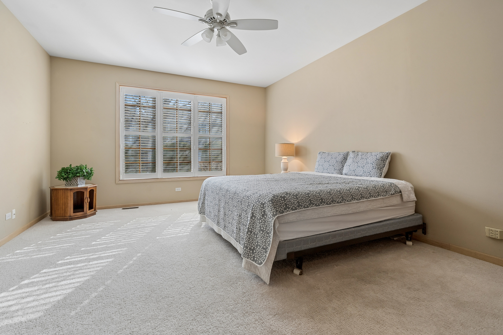 1738 Park Ridge Point Park Ridge, IL 60068 - Photo 13 of 27 a spacious bedroom with a bed and a window