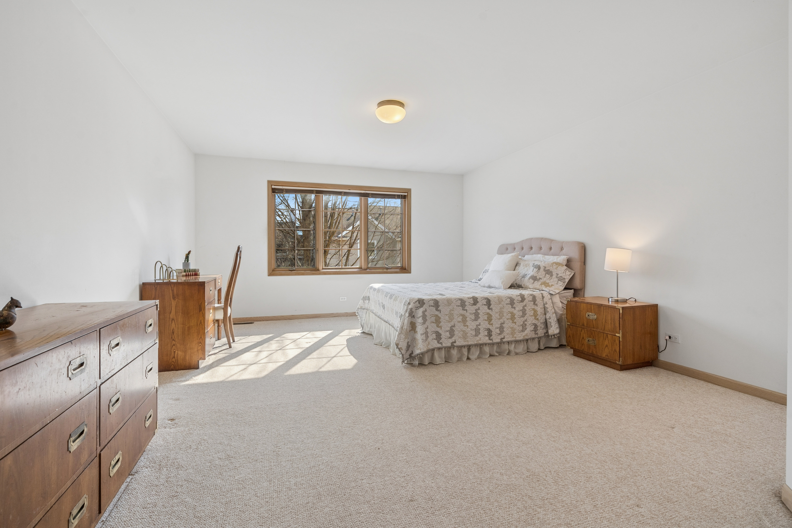 1738 Park Ridge Point Park Ridge, IL 60068 - Photo 18 of 27 a bedroom with a bed and window