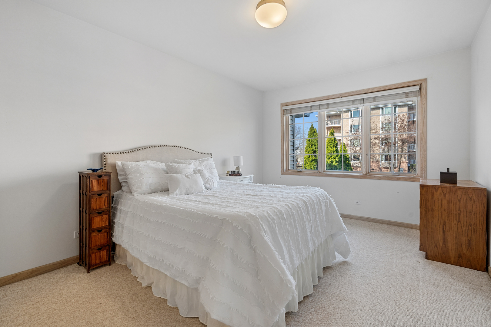 1738 Park Ridge Point Park Ridge, IL 60068 - Photo 19 of 27 a bedroom with a bed and window