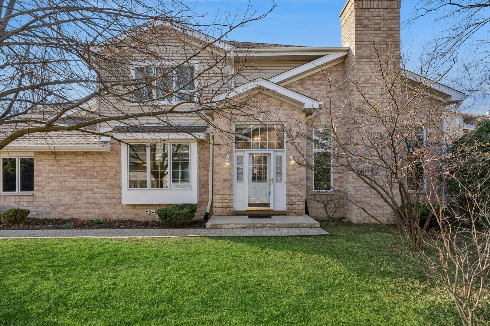 1738 Park Ridge Point Park Ridge, IL 60068 - Photo 2 of 27 a front view of a house with a yard