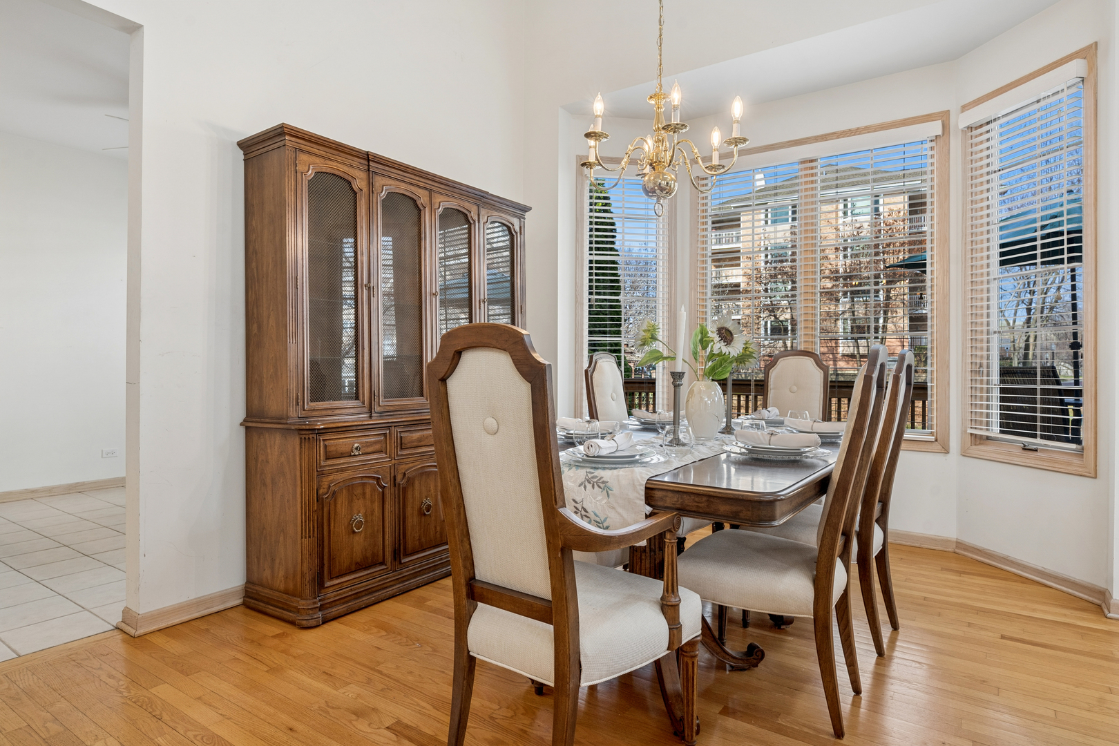 1738 Park Ridge Point Park Ridge, IL 60068 - Photo 6 of 27 a view of a dining room with furniture wooden floor and chandelier