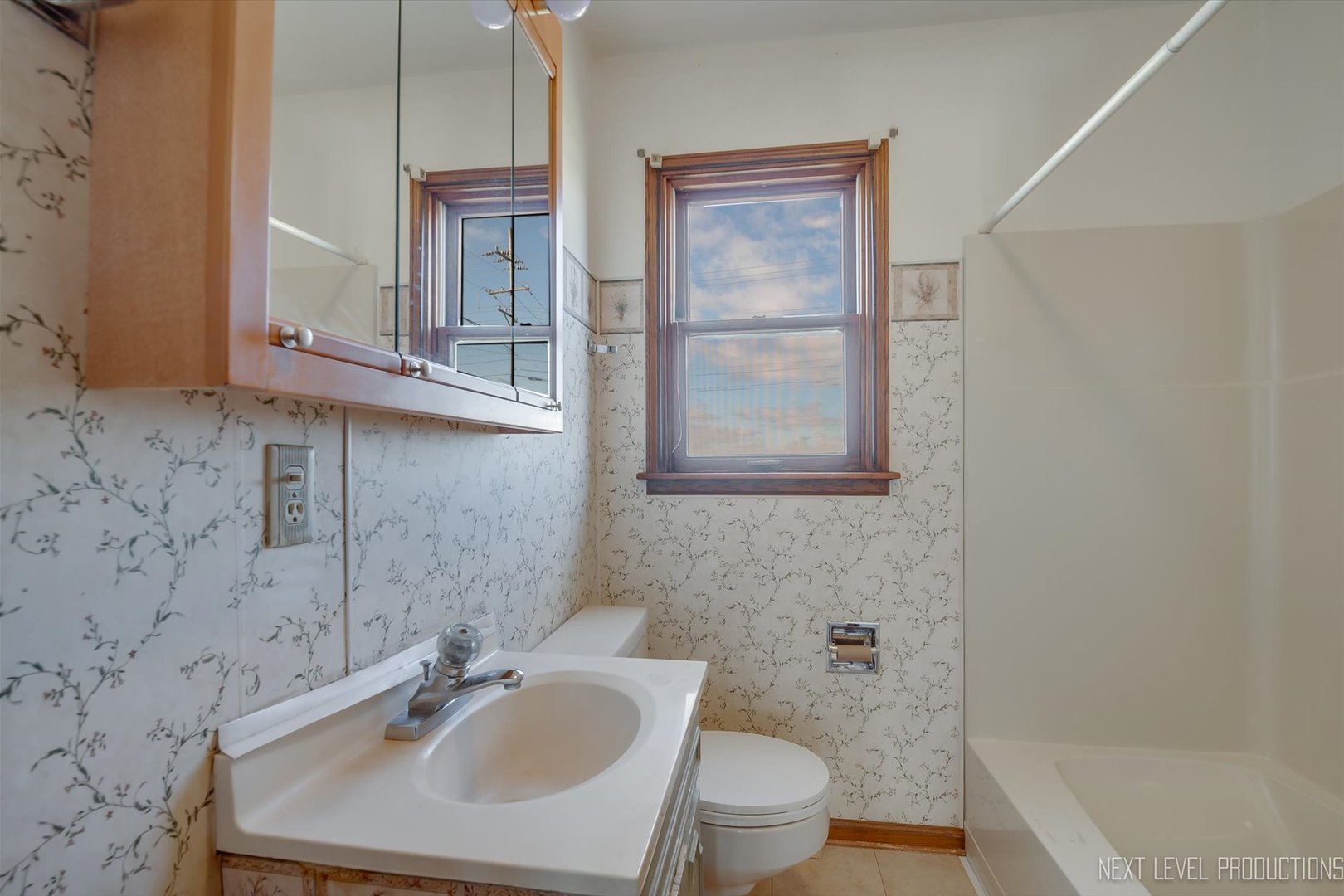 12029 Faxon Road Plano, IL 60545 - Photo 13 of 26 a bathroom with a sink a toilet and shower