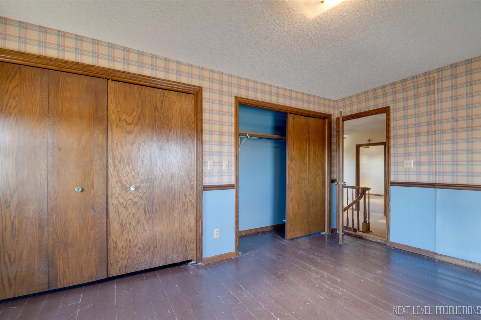 12029 Faxon Road Plano, IL 60545 - Photo 20 of 26 a view of an empty room with wooden floor and a window