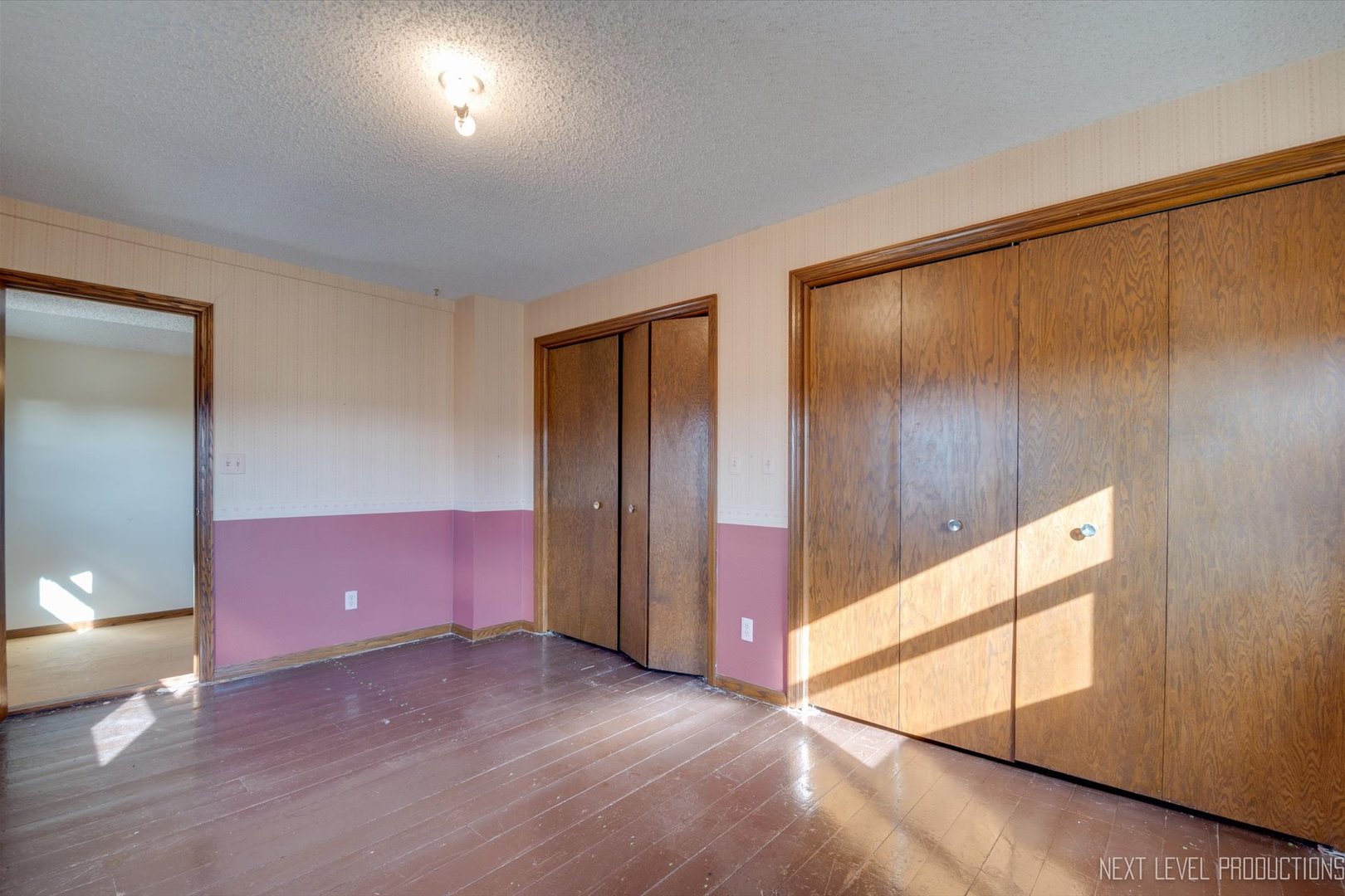 12029 Faxon Road Plano, IL 60545 - Photo 23 of 26 an empty room with wooden floor and windows