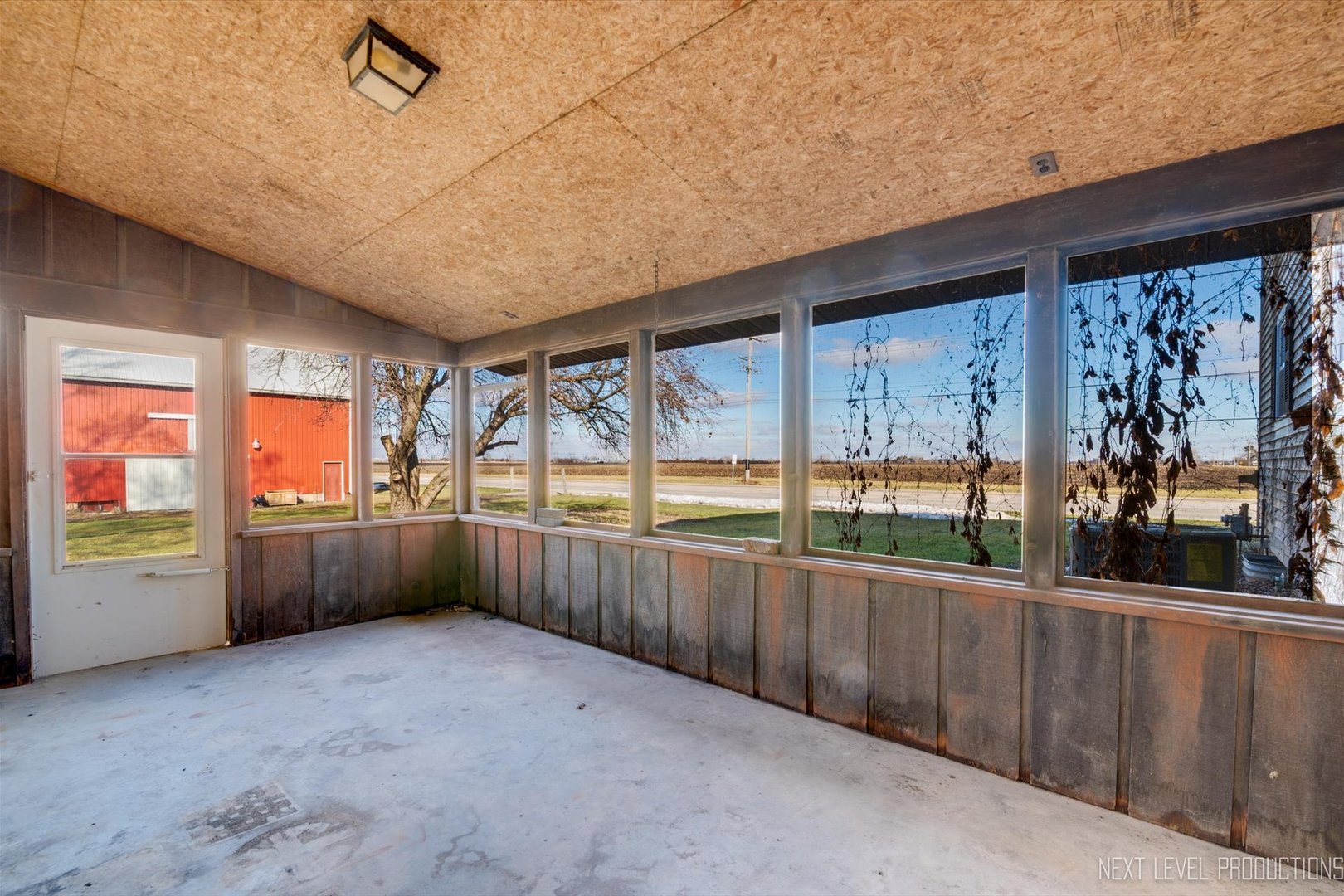 12029 Faxon Road Plano, IL 60545 - Photo 6 of 26 a view of an empty room with a large window