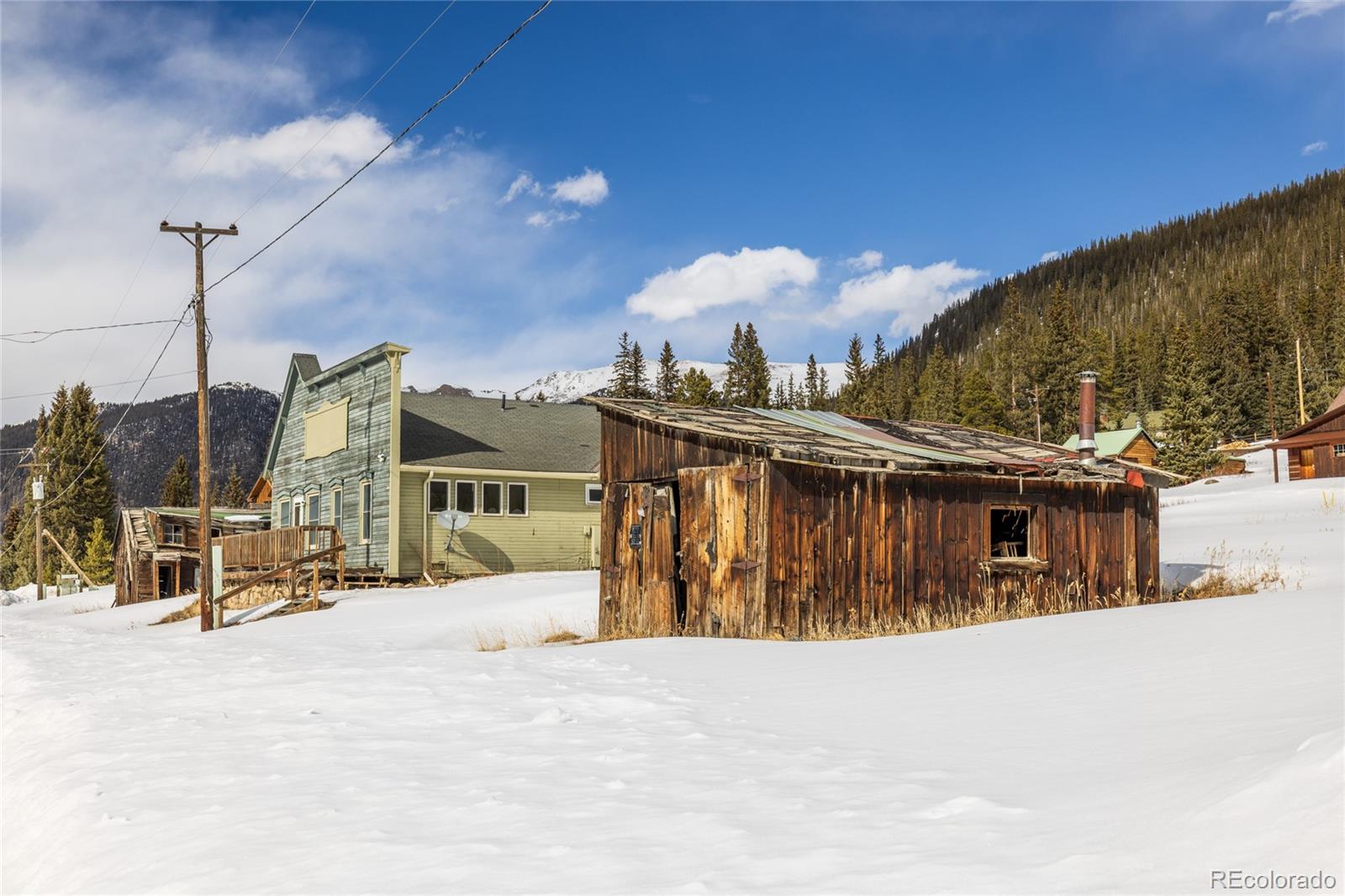 5355 Montezuma Road Montezuma, CO 80435 - Photo 12 of 50 a view of a house with a snow in the yard
