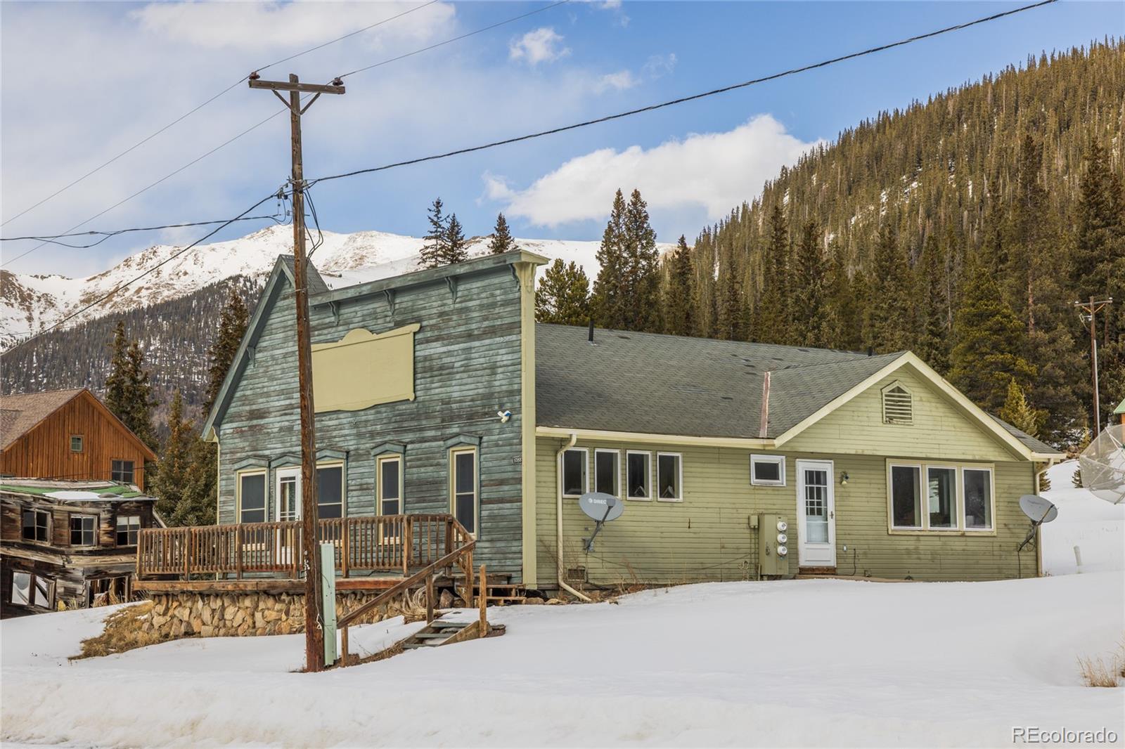 5355 Montezuma Road Montezuma, CO 80435 - Photo 20 of 50 a front view of a house with a yard