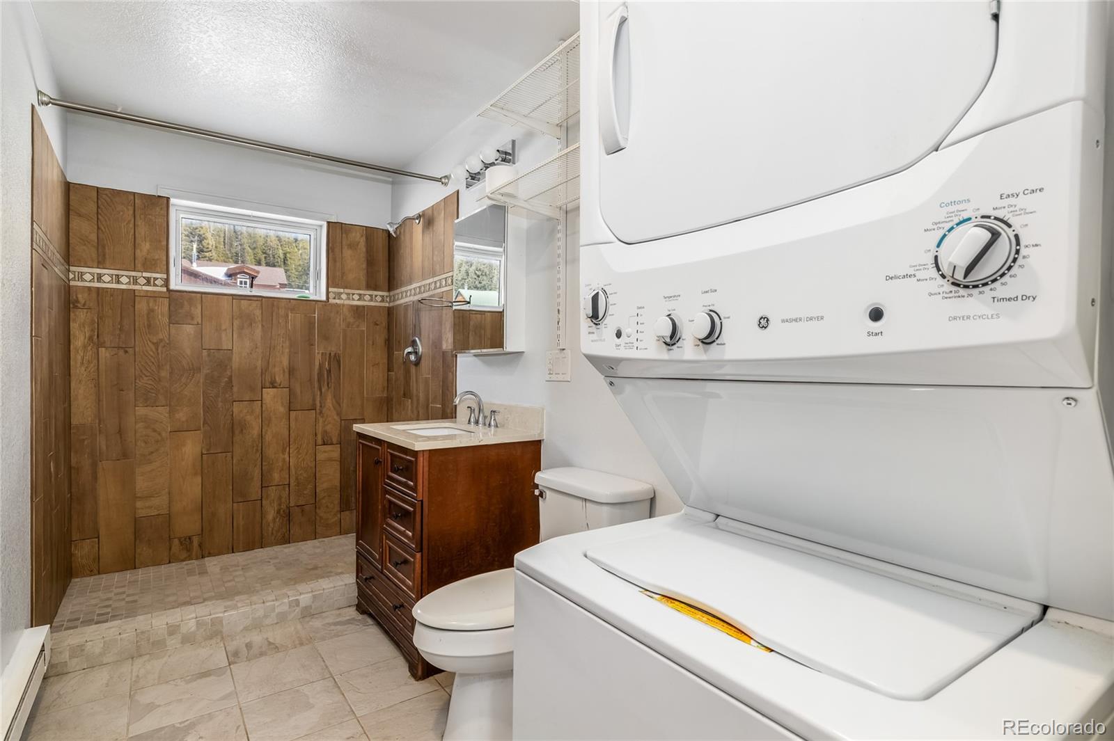 5355 Montezuma Road Montezuma, CO 80435 - Photo 27 of 50 a bathroom with a sink a toilet and shower