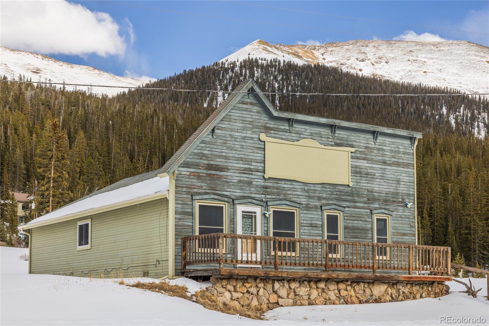 5355 Montezuma Road Montezuma, CO 80435 - Photo 5 of 50 a view of a house with a wooden fence