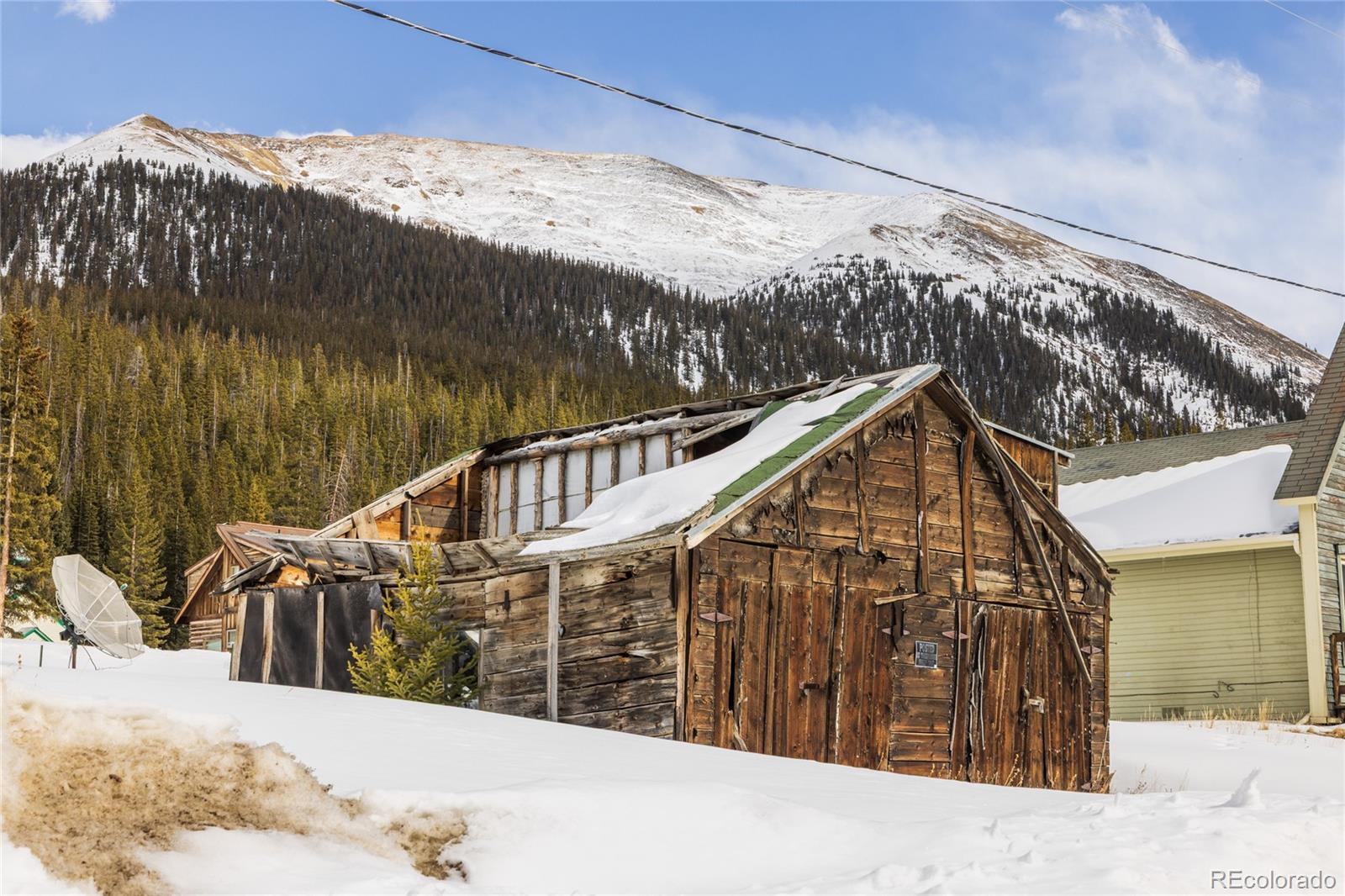 5355 Montezuma Road Montezuma, CO 80435 - Photo 9 of 50 a view of balcony with wooden floor and fence