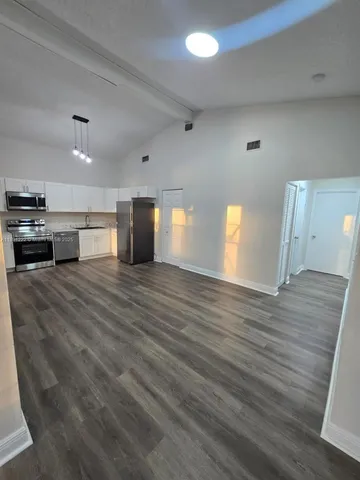 a view of livingroom with furniture and garden view