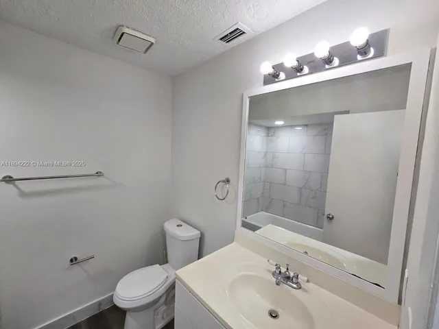 a bathroom with a sink and shower