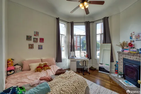 a kitchen with stainless steel appliances granite countertop a sink refrigerator and cabinets